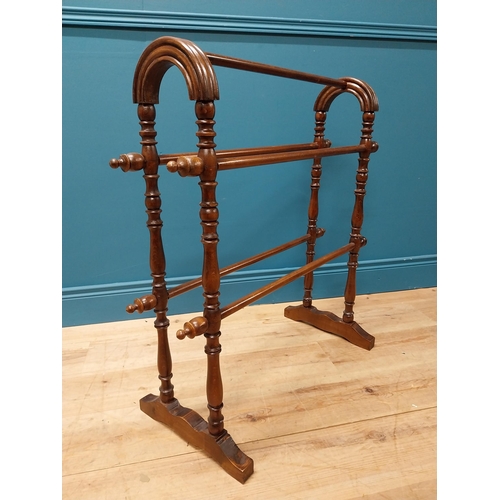 220 - Edwardian oak towel rail raised on turned column and platform feet {82 cm H x 80 cm W x 34 cm D}.