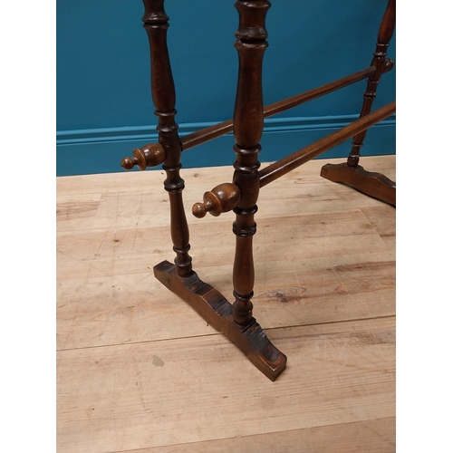 220 - Edwardian oak towel rail raised on turned column and platform feet {82 cm H x 80 cm W x 34 cm D}.