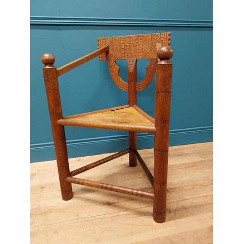 221 - Unusual carved oak chair raised on turned legs {87 cm H x 58 cm W x 52 cm D}.