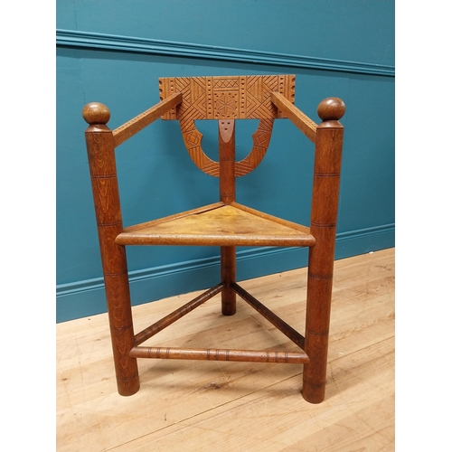 221 - Unusual carved oak chair raised on turned legs {87 cm H x 58 cm W x 52 cm D}.