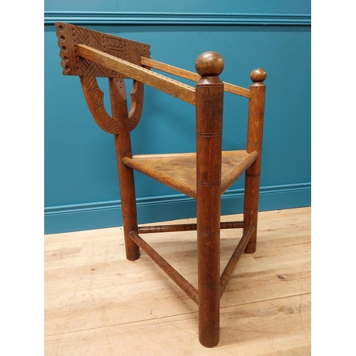 221 - Unusual carved oak chair raised on turned legs {87 cm H x 58 cm W x 52 cm D}.