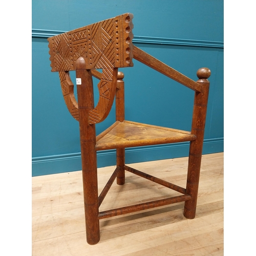 221 - Unusual carved oak chair raised on turned legs {87 cm H x 58 cm W x 52 cm D}.