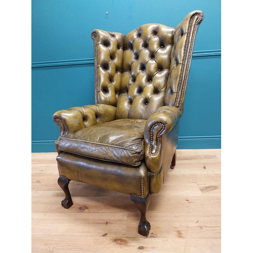 227 - Good quality hand died deep buttoned leather wingback arm chair in the Georgian style {123 cm H x 82... 