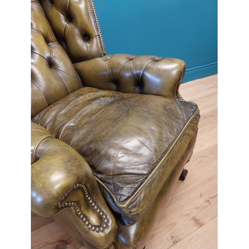 227 - Good quality hand died deep buttoned leather wingback arm chair in the Georgian style {123 cm H x 82... 