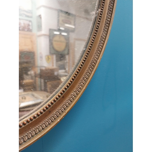 232 - 1950s gilt oval wall mirror in the Victorian style {53 cm H x 40 cm W}.