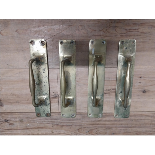 24 - Set of four brass door handles {30 cm H x 7 cm W}.