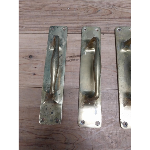 24 - Set of four brass door handles {30 cm H x 7 cm W}.