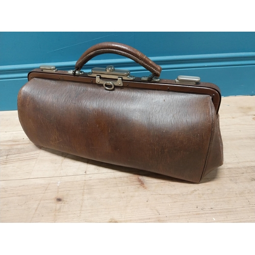 242 - Early 20th C. leather gladstone bag {26 cm H x 47 cm W x 16 cm D}.