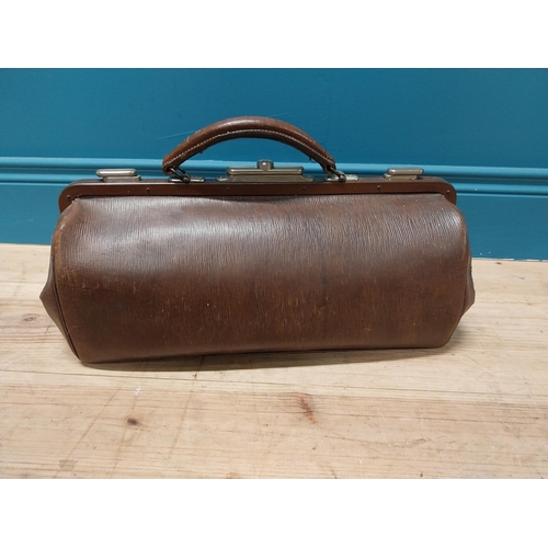 242 - Early 20th C. leather gladstone bag {26 cm H x 47 cm W x 16 cm D}.