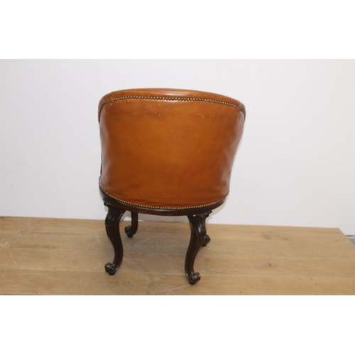 243 - Leather upholstered mahogany swivel tub chair raised on cabriole legs  {H 86cm x W 56cm x D 77cm }.