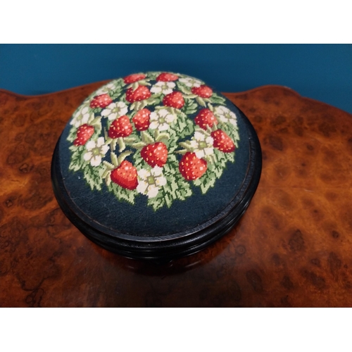 250 - 19th C. ebonised and satinwood pin cushion with tapestry upholstery {12 cm H x 28 cm Dia.}.