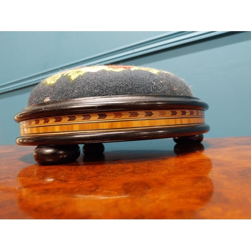 250 - 19th C. ebonised and satinwood pin cushion with tapestry upholstery {12 cm H x 28 cm Dia.}.