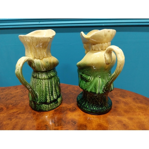 251 - Pair Victorian glazed ceramic majolica Toby jugs {24 cm H x 18 cm W x 12 cm D}.