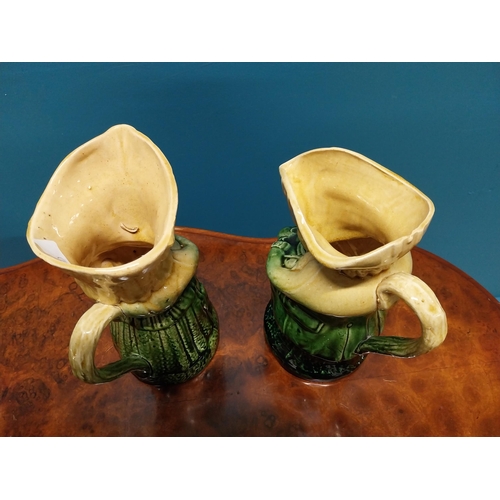 251 - Pair Victorian glazed ceramic majolica Toby jugs {24 cm H x 18 cm W x 12 cm D}.