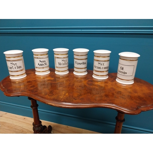 260 - Set of six early 20th C. ceramic and gilded lidded chemist jars {16 cm H x 11 cm Dia.}.