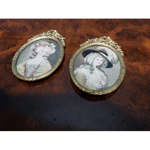 262 - Two Edwardian miniatures mounted in gilded brass frames depicting ladies {11 cm H x 7 cm W}.