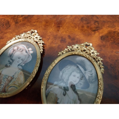 262 - Two Edwardian miniatures mounted in gilded brass frames depicting ladies {11 cm H x 7 cm W}.