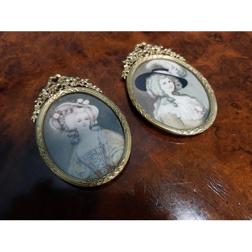 262 - Two Edwardian miniatures mounted in gilded brass frames depicting ladies {11 cm H x 7 cm W}.