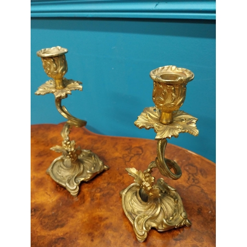 271 - Pair of gilded bronze candlesticks in the Rocco style {23 cm H x 10 cm W x 9 cm D}.