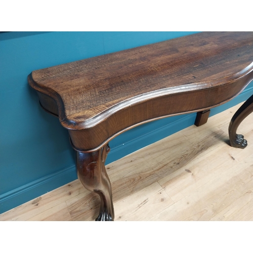 277 - William IV oak serpentine front side table raised on cabriole legs and lions paw feet {80 cm H x 138... 