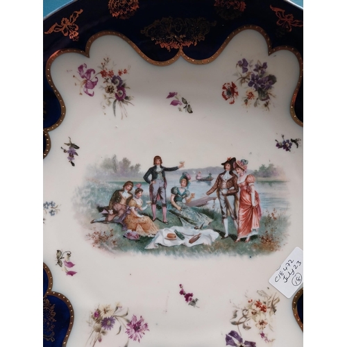 281 - Pair of early 20th C. hand painted Austrian chargers decorated with Musical and Picnic scenes {34 cm... 