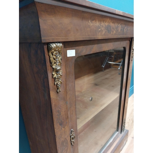 285 - 19th C. French walnut and satinwood inlaid pier cabinet with single glazed door raised on platform b... 