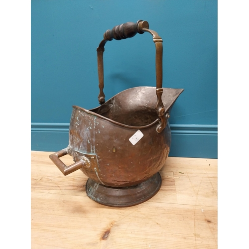 290 - Early 19th C. copper coal helmet with ebony handle {50 cm H x 31 cm W x 48 cm D}.