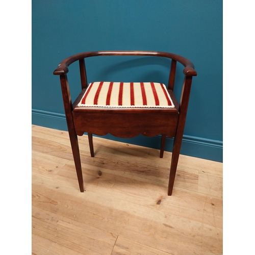 296 - Edwardian mahogany and upholstered piano stool with lift up seat raised on square tapered legs {63 c... 