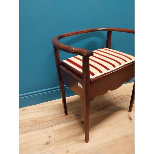 296 - Edwardian mahogany and upholstered piano stool with lift up seat raised on square tapered legs {63 c... 