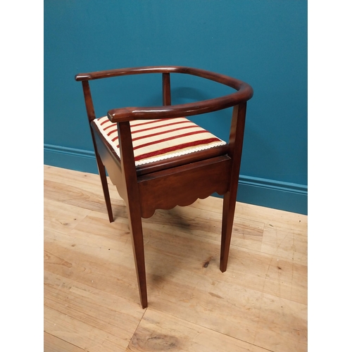 296 - Edwardian mahogany and upholstered piano stool with lift up seat raised on square tapered legs {63 c... 