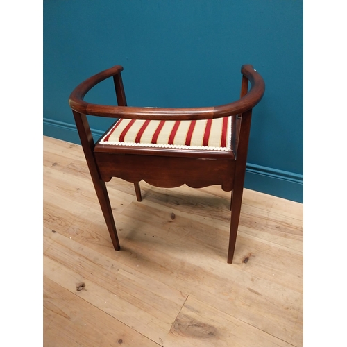 296 - Edwardian mahogany and upholstered piano stool with lift up seat raised on square tapered legs {63 c... 