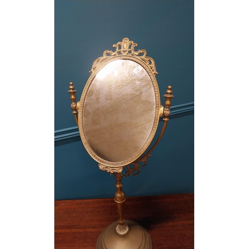 31 - Early 20th C. decorative brass dressing table mirror {70 cm H x 30 cm W x 21 cm D}.