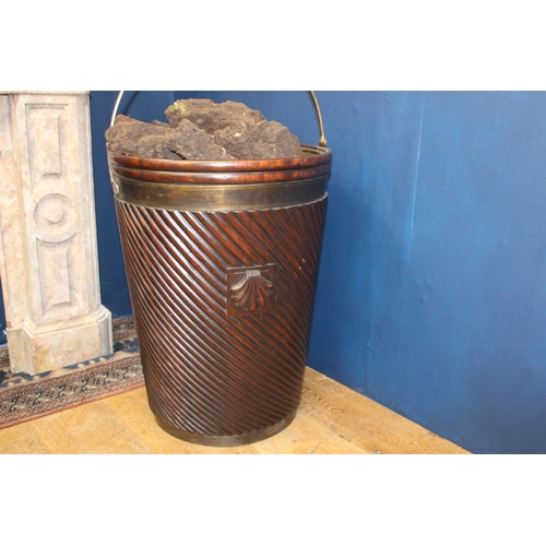 319 - Pair of Irish mahogany spiral peat buckets with brass mounts {H 66cm x Dia 50cm }.