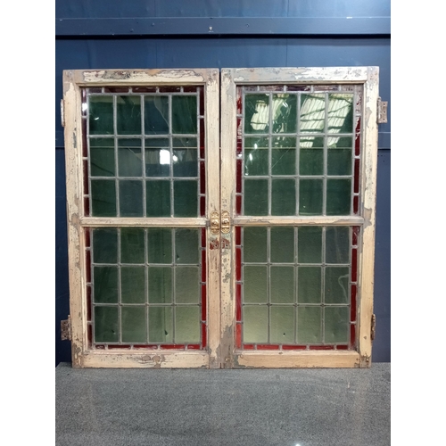 323 - Pair of leaded stain glass windows with brass locks {Each H 98cm x W 50cm x D 3cm }.