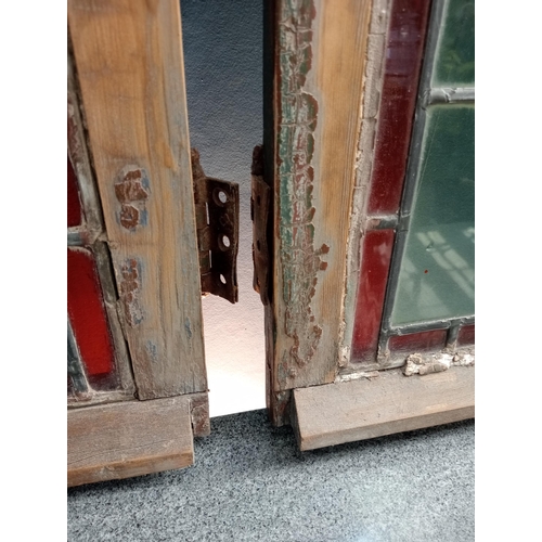 323 - Pair of leaded stain glass windows with brass locks {Each H 98cm x W 50cm x D 3cm }.