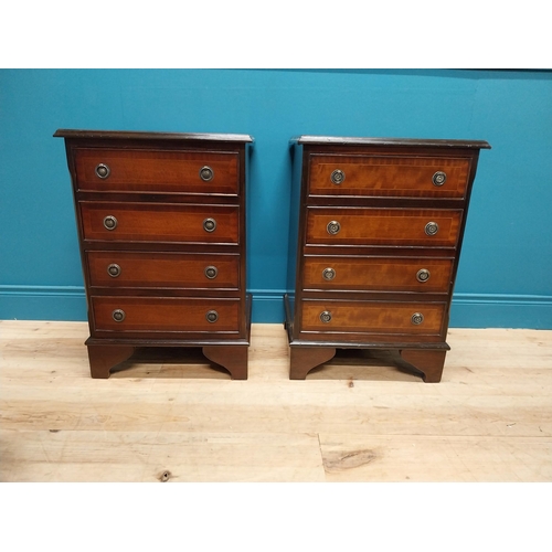 327 - Pair of good quality mahogany and satinwood inlaid bedside cabinets with four drawers raised on brac... 