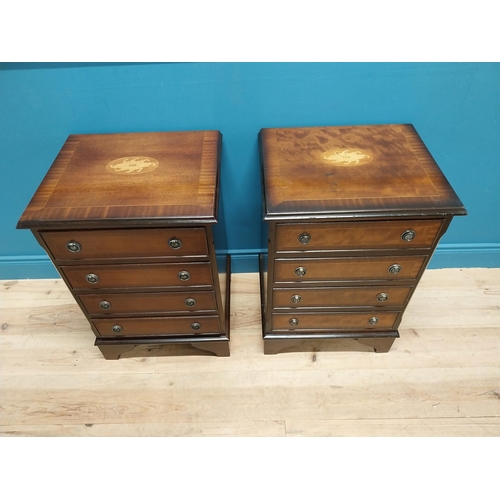 327 - Pair of good quality mahogany and satinwood inlaid bedside cabinets with four drawers raised on brac... 