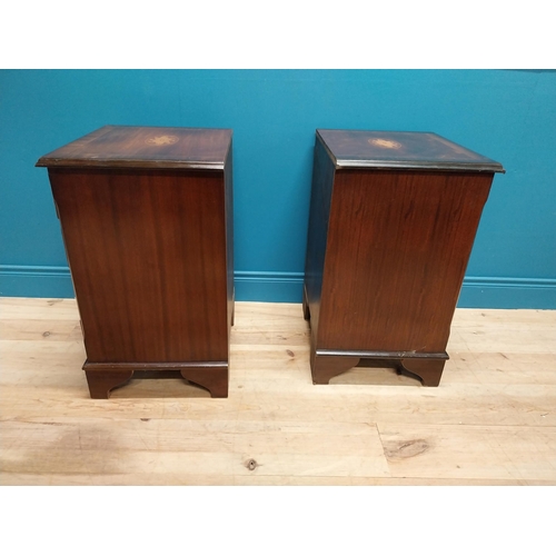 327 - Pair of good quality mahogany and satinwood inlaid bedside cabinets with four drawers raised on brac... 