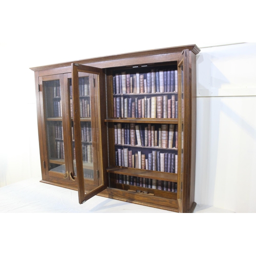 332 - Hanging oak four door cabinet with book wall paper back and brass handles {115 cm H x 156 cm W x 19 ... 