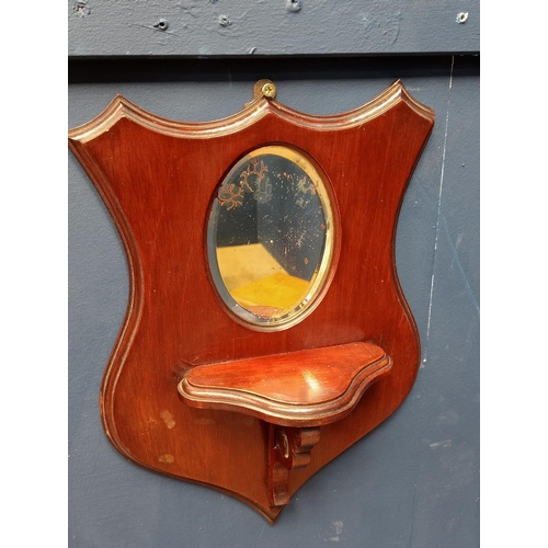 333 - Pair of mahogany shield mirrors {H 36cm x W 26cm x D 10cm }.