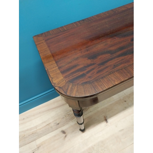 347 - Georgian mahogany and rosewood turn over leaf card table raised on turned legs and brass castors {73... 