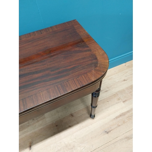 347 - Georgian mahogany and rosewood turn over leaf card table raised on turned legs and brass castors {73... 