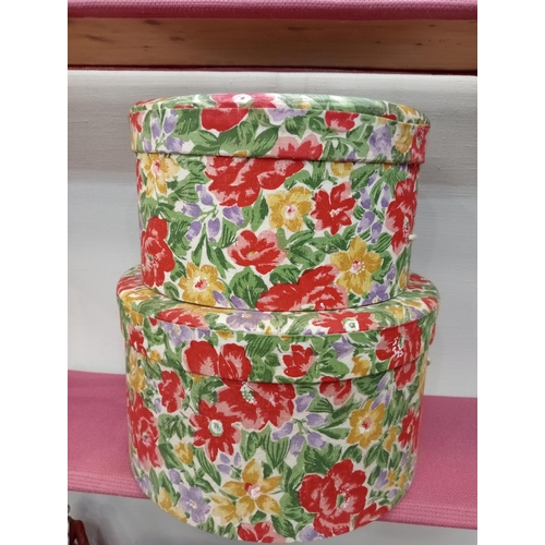 349 - Pair of red rose fabric hat boxes {H 18cm x Dia 30cm H 15cm x Dia 25cm}.