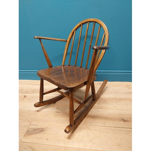 356 - 1950s ash child's Windsor rocking chair {70 cm H x 61 cm W x 74 cm D}.