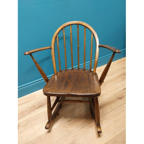 356 - 1950s ash child's Windsor rocking chair {70 cm H x 61 cm W x 74 cm D}.