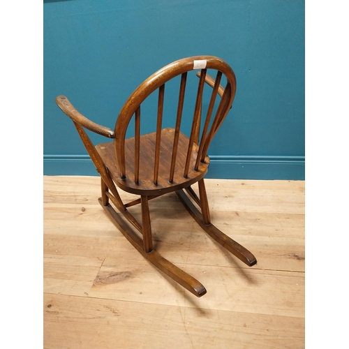 356 - 1950s ash child's Windsor rocking chair {70 cm H x 61 cm W x 74 cm D}.