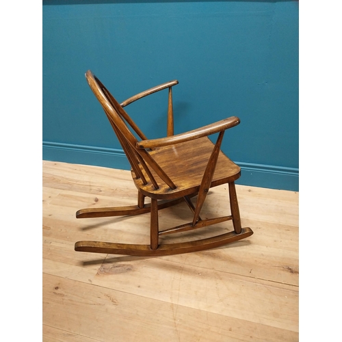 356 - 1950s ash child's Windsor rocking chair {70 cm H x 61 cm W x 74 cm D}.