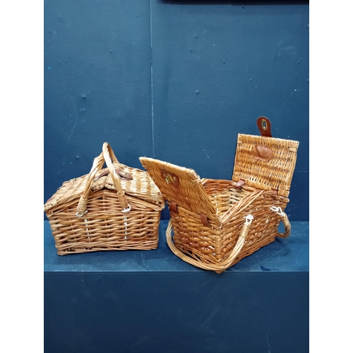 363 - Pair of wicker swing handle picnic baskets {H 30cm x W 30cm x D 20cm}.