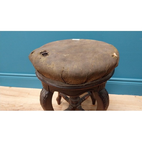 370 - Victorian carved mahogany revolving piano stool with upholstered seat {48 cm H x 34 cm Dia.}.