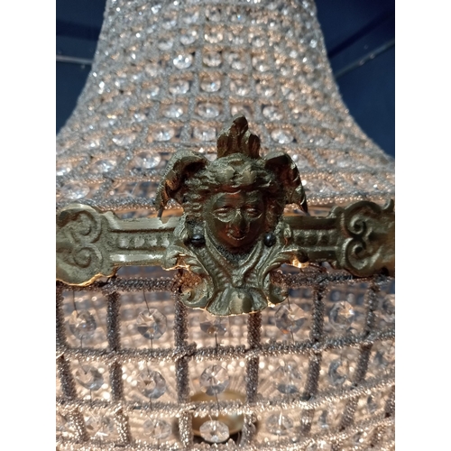 373 - Pear drop crystal and bronze six light chandelier {H 100cm x Dia 60cm}.